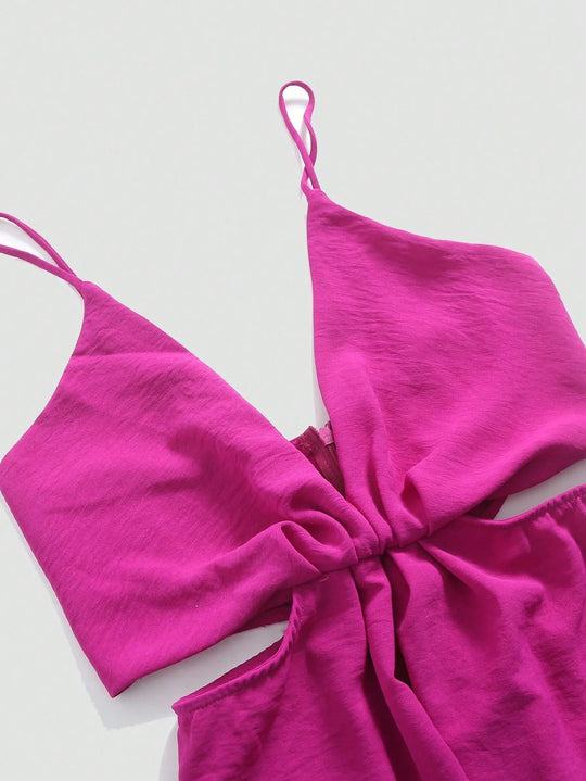 Udhulet plisseret jumpsuit med brede ben